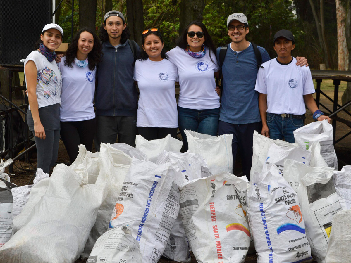 PlastiCo members and participants for the #BrandAudit2019 during the World Cleanup Day pose in front of their collected sacks of trash