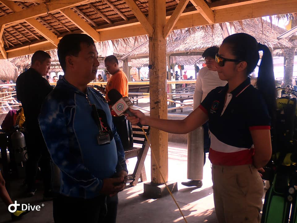 A man is being interview by a reporter during the #BrandAudit2019 in Davao del sur, Philippines