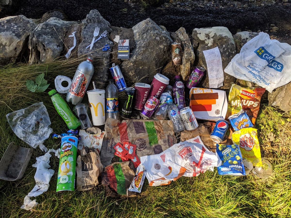 A pile of trash above some rocks