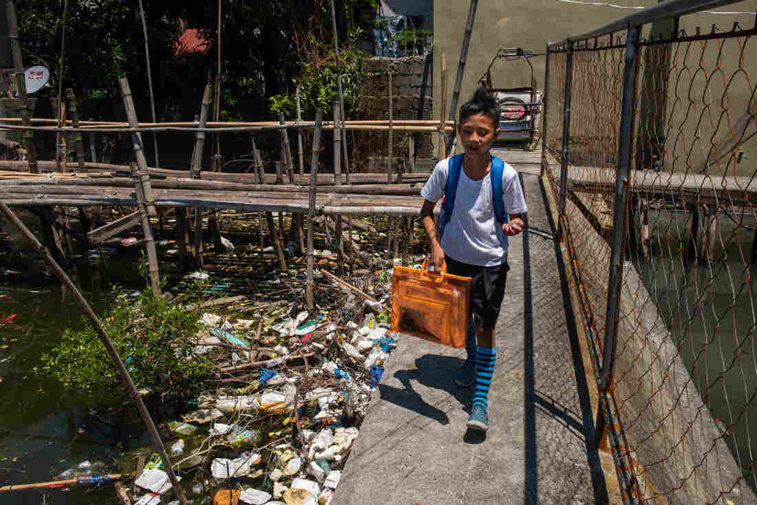 student-walking-to-school-trash-community